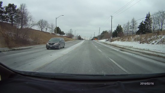 Filming with the Ausdom A261 in Mississauga during the day, passing a car.